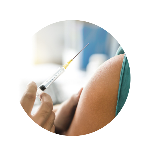 doctor giving injection in patient arm 