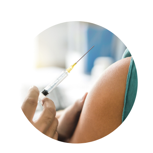 doctor giving injection in patient arm 